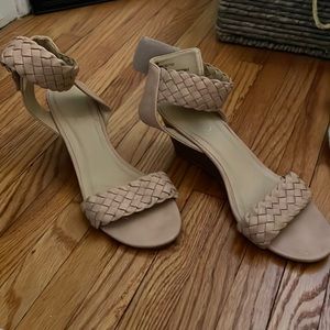 Tan sandals with small wedge and Velcro around the ankle. Excellent condition.